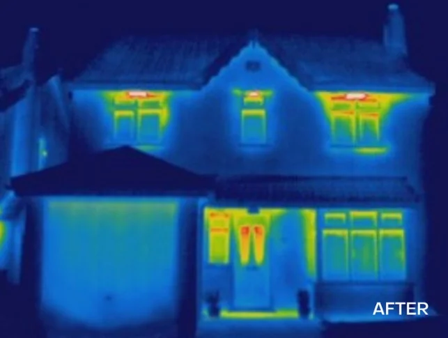 Thermal image showing heat retained in home after insulation